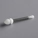 A white plastic and silver metal Narvon tap valve lever pin.
