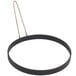 A black metal egg omelet ring with a metal handle.