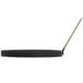A black round pan with a black handle.
