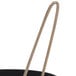 A black metal egg omelet ring with a handle.