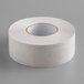 A roll of white paper tickets with a green border.