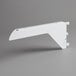 A white metal shelf bracket with a screw on it.