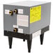 A grey Hatco booster water heater with gold pipes.