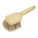 A close-up of a Carlisle Sparta tan utility brush with bristles.