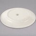 A Homer Laughlin ivory china plate with a rolled edge and a small logo on it.