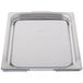 A Vollrath stainless steel tray with a lid.