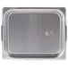 A Vollrath stainless steel tray with a lid.