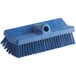 A Carlisle blue floor scrub brush with a long handle.