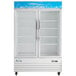 An Avantco white swing glass door merchandiser freezer.