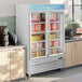 An Avantco swing glass door merchandiser freezer with a white exterior.