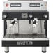 A black and silver Astra Mega II Compact automatic espresso machine with buttons and dials.