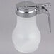 A white polypropylene Tablecraft syrup dispenser with a chrome plated metal top.