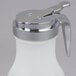 A white polypropylene Tablecraft syrup dispenser with a chrome metal top.