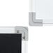 A close-up of a white surface of a Chef Master reversible black and white marker board.
