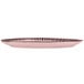 A pink stoneware platter with black lines on it.