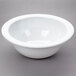 A white Thunder Group Nustone melamine bowl with a white rim.