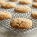 A close up of a cookie on a Regal Ground Ginger cooling rack.