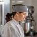 A woman in a Choice houndstooth mesh top chef hat.