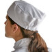 A woman wearing a white Choice mesh top chef hat.