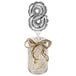 A jar with a silver "8" balloon.