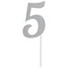 A silver glitter "5" cake topper on a white background.