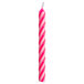 A pink and white striped Creative Converting spiral candle.