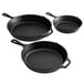 A group of three Lodge pre-seasoned cast iron skillets.