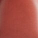 A close-up of a burgundy vinyl seat from a chair.
