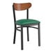 A Lancaster Table & Seating Boomerang Series chair with a green vinyl seat and antique walnut wood back on a black frame.