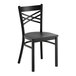 A black metal chair with a cross back design and a black wood seat.
