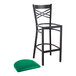 A Lancaster Table & Seating black cross back bar stool with a green cushion.