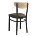 A Lancaster Table & Seating Boomerang Series black chair with dark brown vinyl seat and driftwood back.