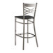 A Lancaster Table & Seating cross back bar stool with a black wood seat.