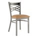 A Lancaster Table & Seating metal chair with a light brown vinyl padded seat.