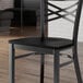 A black wood seat for a metal frame chair.