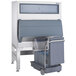 A grey Follett ice storage bin with a cart attached.
