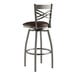 A Lancaster Table & Seating metal swivel bar stool with a dark brown vinyl seat.