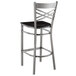 A Lancaster Table & Seating clear coat finish bar stool with black wood seat and backrest.