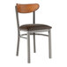 A Lancaster Table & Seating Boomerang wood and metal restaurant chair with a brown vinyl seat.