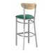 A Lancaster Table & Seating bar stool with a green vinyl seat and driftwood back.