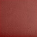 A detached burgundy vinyl padded seat with a red border.