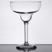 A Libbey clear coupette/margarita glass with a stem on a table.