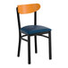 A black metal chair with a navy vinyl seat and a cherry wood backrest.