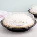 a pie in a plastic container