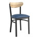 A Lancaster Table & Seating Boomerang Series chair with navy vinyl seat and driftwood back.