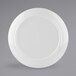 A white Elite Global Solutions round melamine plate with a small rim.