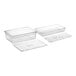 A group of clear Cambro plastic food pans with lids and trays.