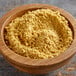 A bowl of Old Bay Crab Cake Classic Mix, a yellow powder.