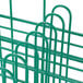 A close-up of a green metal Microwire 12 Compartment Charger Plate Catering Rack.