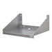 A stainless steel microwave shelf with side supports and wall-mounting holes.